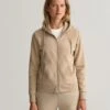 Gant Naisten Huppari TONAL ARCHIVE SHIELD ZIP HOODIE Vaalea Beige 1 Gant Naisten Huppari TONAL ARCHIVE SHIELD ZIP HOODIE Vaalea Beige -Kekäle gant naisten huppari tonal archive shield zip hoodie vaalea beige 1